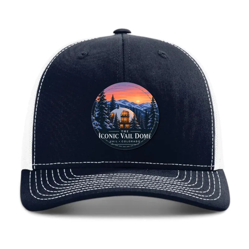The Dome Trucker in navy with white mesh, front view with the full-color Iconic Vail Dome sunset patch