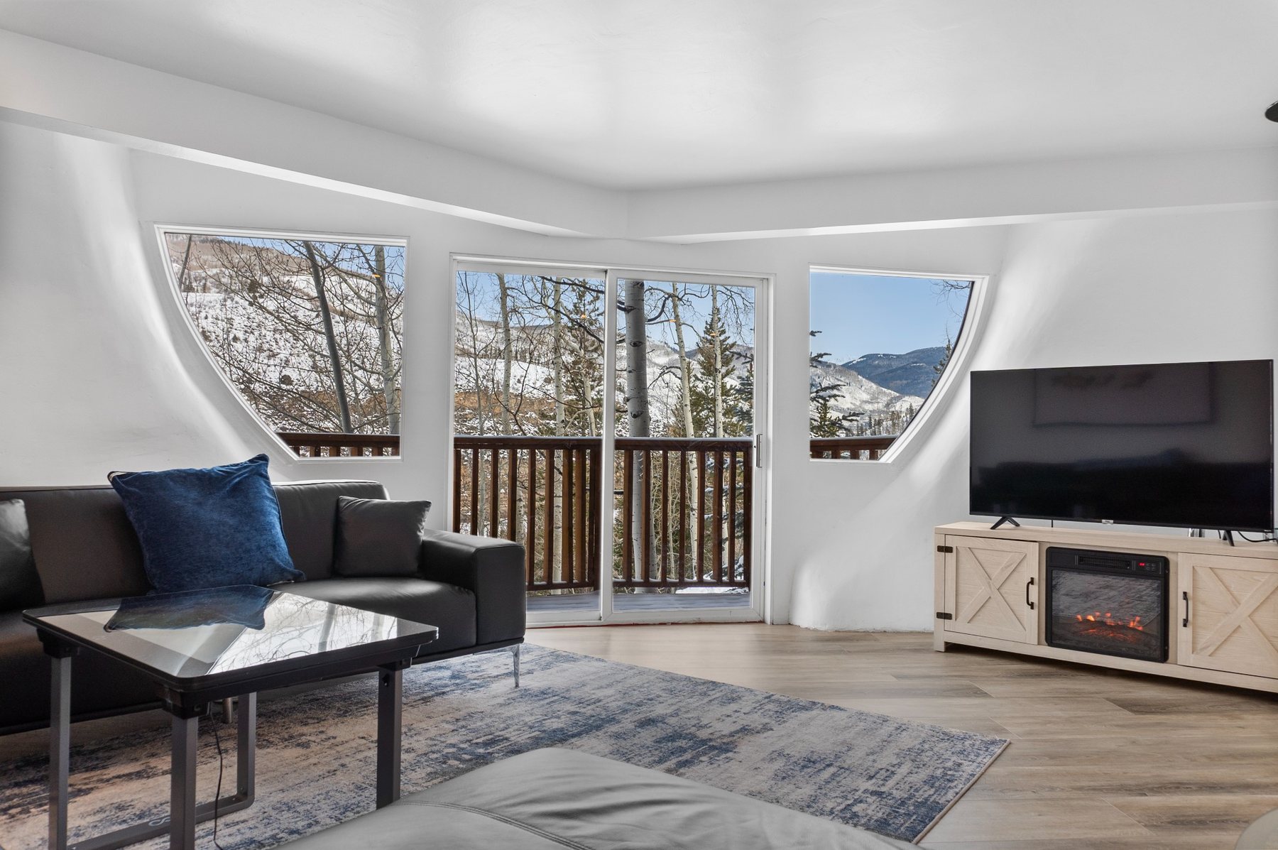 Unit 2 living room with mountain-facing windows